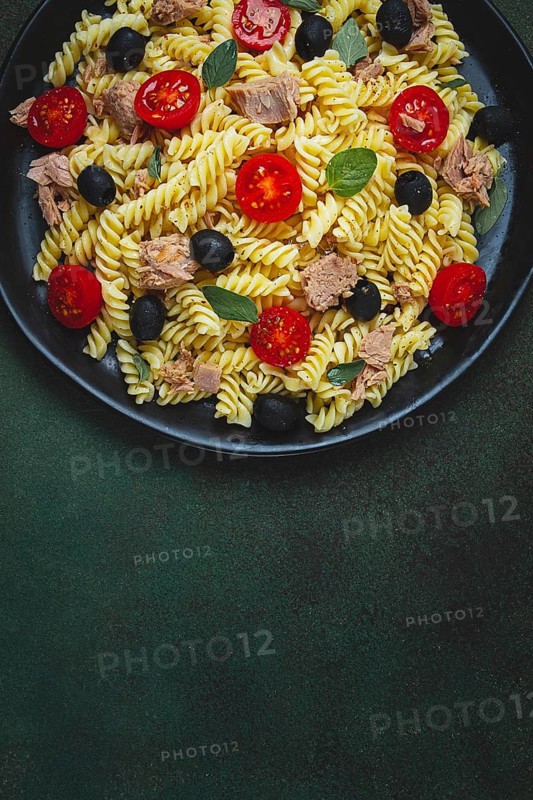 Tuna salad, fusilli pasta, olives and cherry, olive oil, homemade