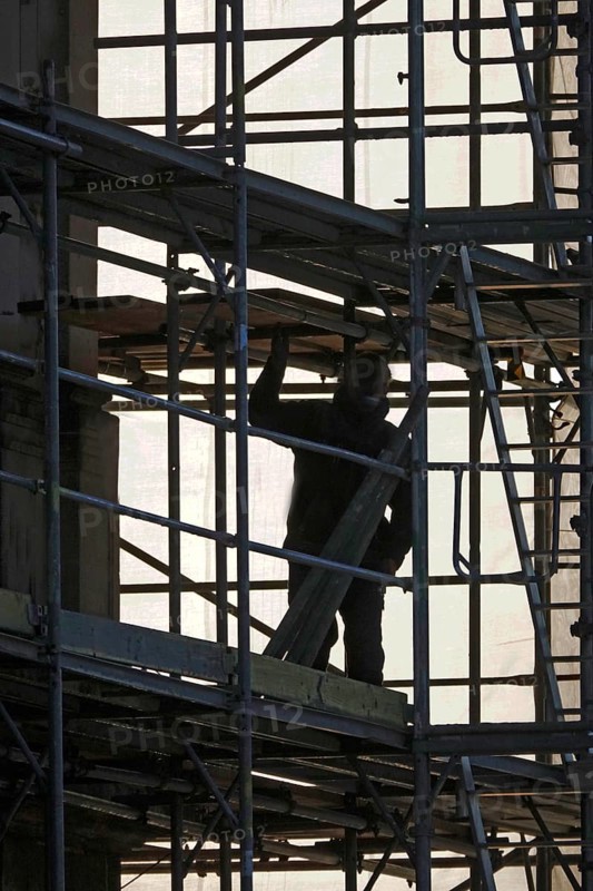 Scaffolders erecting scaffolding, November, Germany, Europe