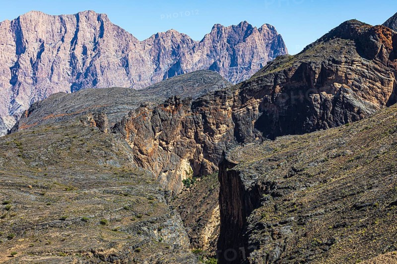 Vegetation-free slopes and gorges, behind the mountains of the Hajar Mountains, Arabian Peninsula, Sultanate of Oman