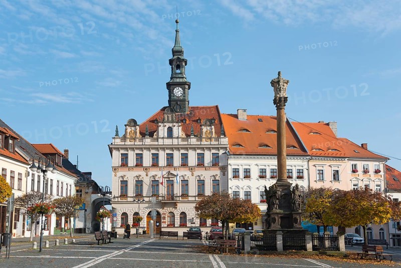 Town hall with clock tower on the market square in baroque style in sunny weather, Town hall and plague column column of the Holy Trinity, Ceská Lípa, Bohemian Leipa, Leipa, Liberecký kraj, Bohemia, Czech Republic, Europe