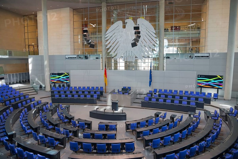 Symmetrical plenary chamber with blue chairs and large eagle as a central element, political ambience, Reichstag building, German Bundestag, Berlin, Germany, Europe