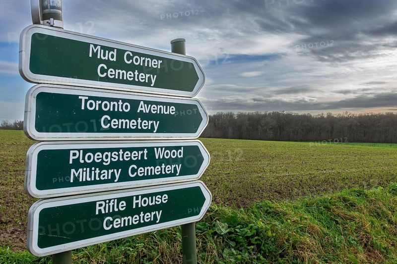 Signposts showing directions to different WW1 military cemeteries on former World War One battlefield at Ploegsteert, Plugstreet, Hainaut, Belgium, Europe