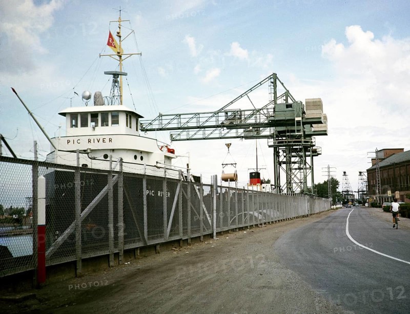 'Pic River' cargo ship (built 1896) and quayside cranes, Welland canal, St Lawrence seaway, Great Lakes, Ontario, Canada, North America 1963, North America