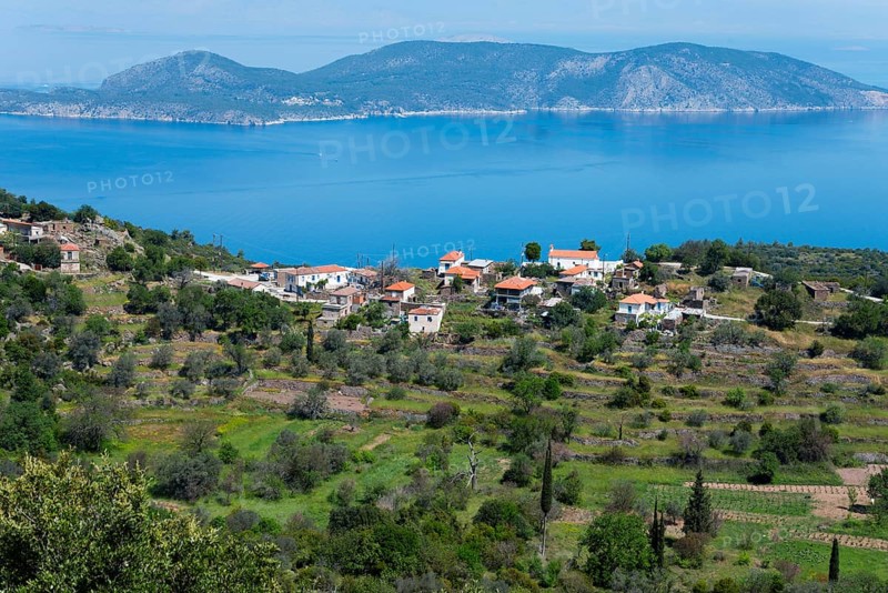 Coastal landscape with traditional houses and hills surrounded by blue sea and green vegetation, Makriloggos, Methana, peninsula in the Argolis on the Saronic Gulf, Attica, Peloponnese, Greece, Europe