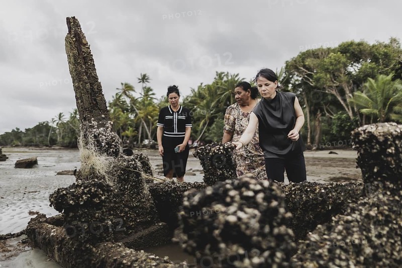 (R-L) Annalena Bärbock (Bündnis 90/Die Grünen), Federal Foreign Minister, and Lavenia McGoon, resident of the Togoru settlement, photographed during a briefing on coastal erosion at a cemetery near the Togoru settlement flooded by rising sea levels, 07.05.2024. Bärbock is travelling to Australia, New Zealand and Fiji for political talks / Photographed on behalf of the Federal Foreign Office