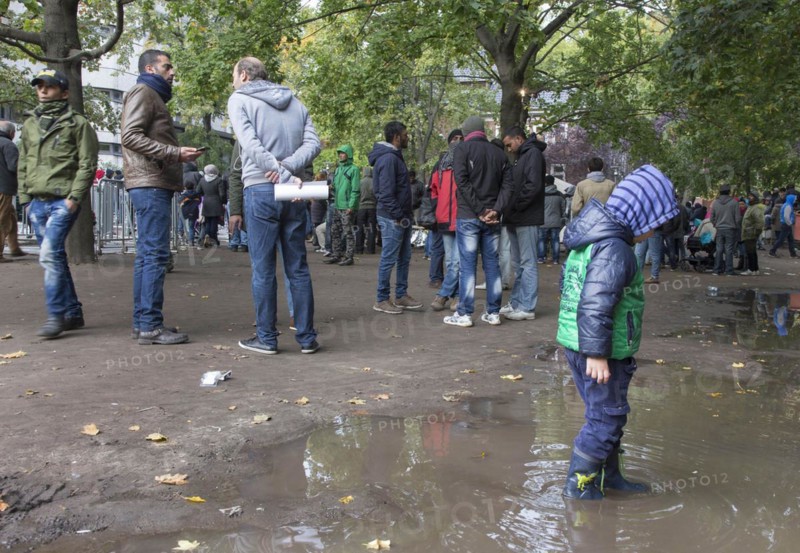 Refugees from Syria waiting to be registered at the Central Reception Centre for Asylum Seekers at the Berlin State Office for Health and Social Affairs, 09.10.2015