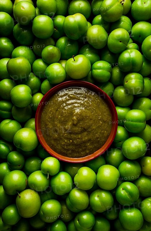 Tkemali sauce, traditional Georgian cuisine, green cherry plum, with ingredients for sauce, cilantro, mint, hot pepper, garlic, on a wooden table, close-up, rustic, food background, no people, selective focus, sauce, green sauce, tkemali, georgian cuisine, homemade