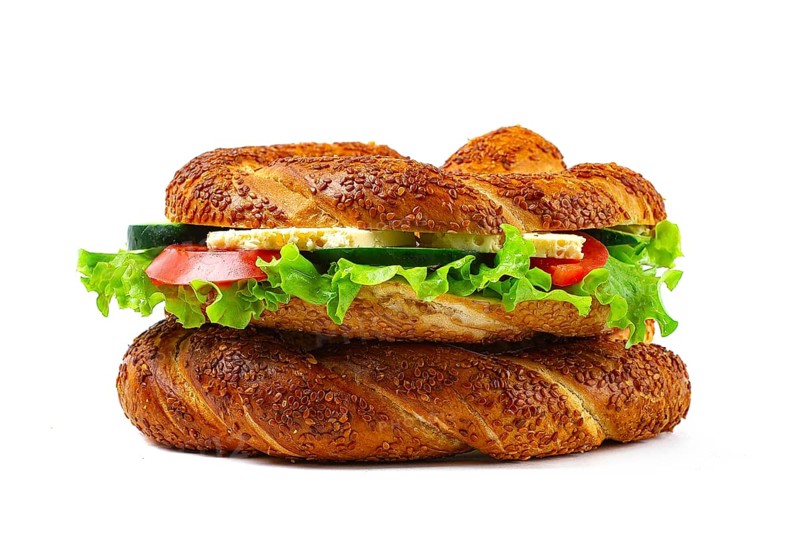 Traditional Turkish bagel simit, breakfast, on a white background, horizontal, no people