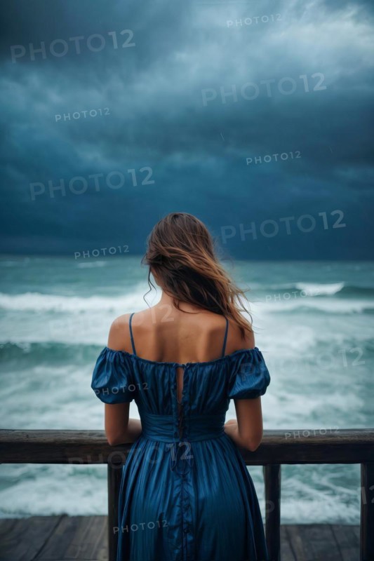 A depressed lonely woman is standing on an ocean shore wearing a blue dress, AI generated
