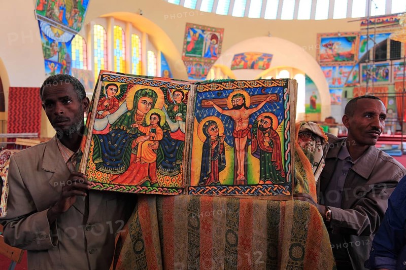 Tigray region, Axum, Aksum, St Mary's Cathedral, Maryam Tsion, inside, church servant shows old bible of the cathedral, Ethiopia, Africa