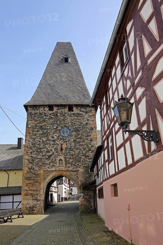 Historic clock tower and landmark, town gate, town tower, street lamp, Herrstein, Hunsrück, Rhineland-Palatinate, Germany, Europe