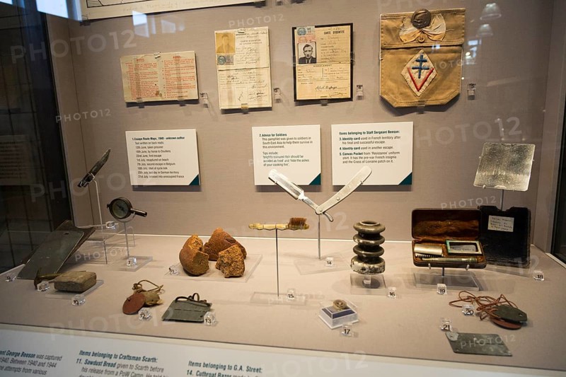 Display cabinet of second world war Prisoner of War objects, REME museum, MOD Lyneham, Wiltshire, England, UK