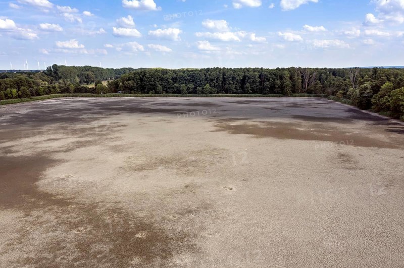 Aerial view of dried up fish ponds in Reckahn in Brandenburg. The Plane, a river that normally fills the fish ponds with water, is dry and no longer carries water, 09/08/2022