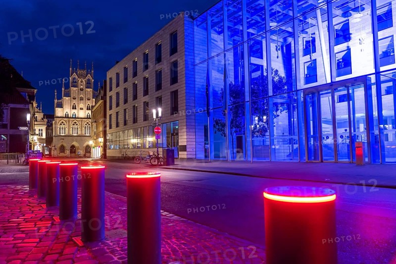 Historic old town, facade of the historic town hall, blue illuminated building of the Münster district government, illuminated barrier, bollards, in Münster, North Rhine-Westphalia, Germany, Europe
