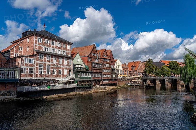 The old town of Lüneburg, Stintmarkt square on the Ilmenau river, historic harbour district, many restaurants, pubs, cafés, Lower Saxony, Germany, Europe