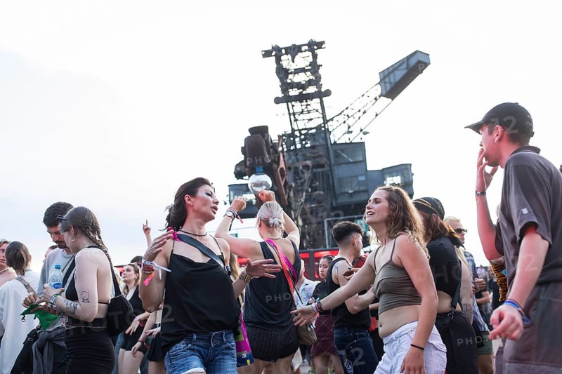 Celebrating visitors in front of excavators at the Melt Festival in Ferropolis on 12 July 2024. After a total of 27 years, the festival will take place for the last time in 2024