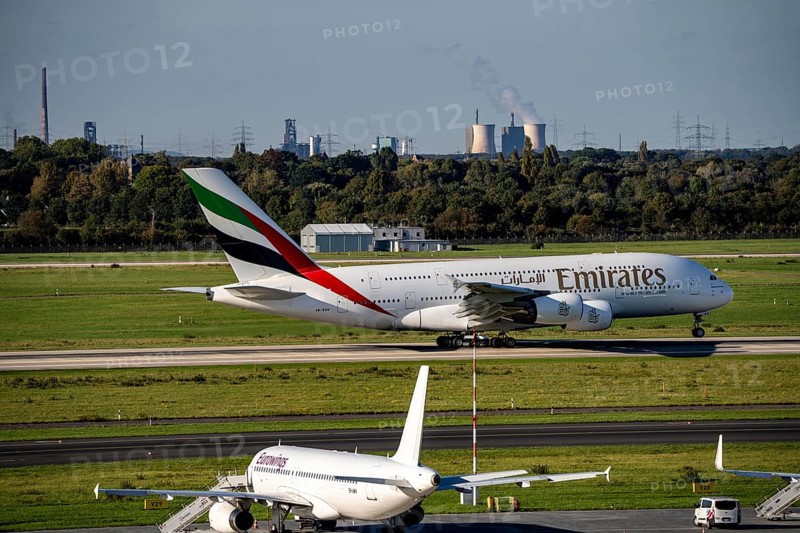 Düsseldorf Airport, Emirates Airbus A380-800 taking off, in the background the HKM steelworks in Duisburg