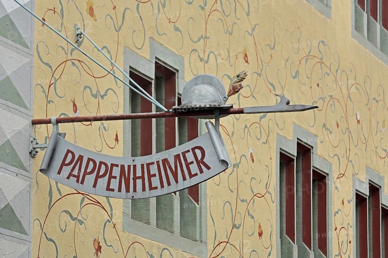 Nose sign on the historic building Pappenheimer with wall painting and decorations, lance with helmet, inscription, arts and crafts, market square, Engen, Hegau, Baden-Württemberg, Germany, Europe