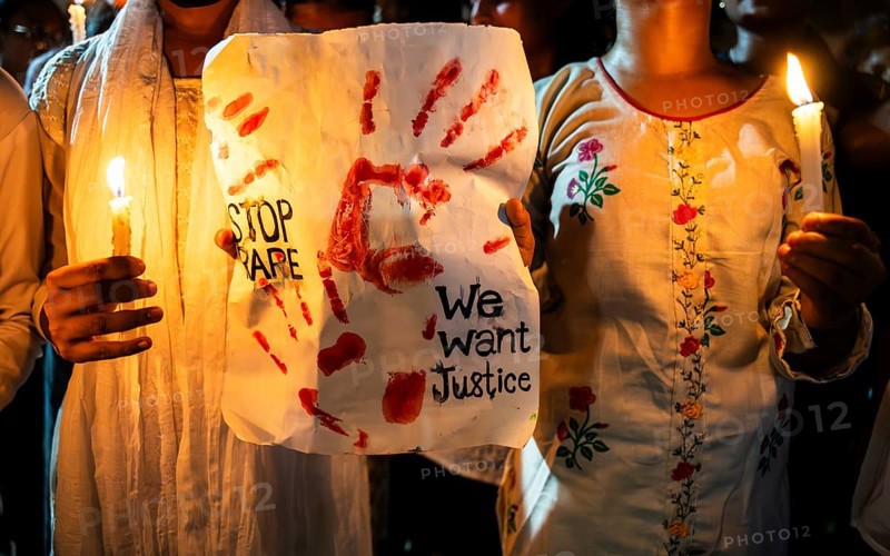 Students holds candle and shout slogans as they participate in a protest against the rape and murder of a doctor inside a hospital in Kolkata, on August 18, 2024 in Guwahati, India. A trainee doctor, 31, was attacked at RG Kar Medical College and Hospital in Kolkata, the capital of West Bengal, last week
