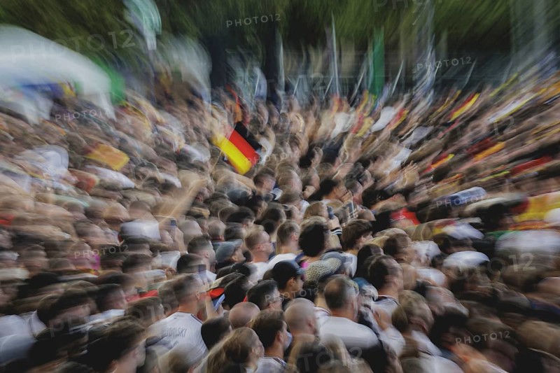 Fans react during the European Championship preliminary round match between Germany and Hungary on the fan mile in front of the Brandenburg Tor in Berlin, 19 June 2024