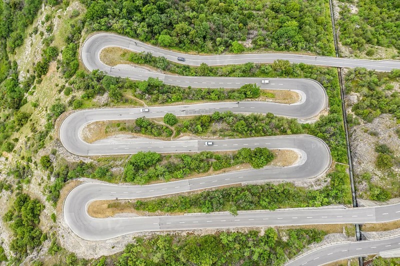 Aerial view, drone shot, Mountain pass road with multiple hairpins, water pipeline, Switzerland, Europe