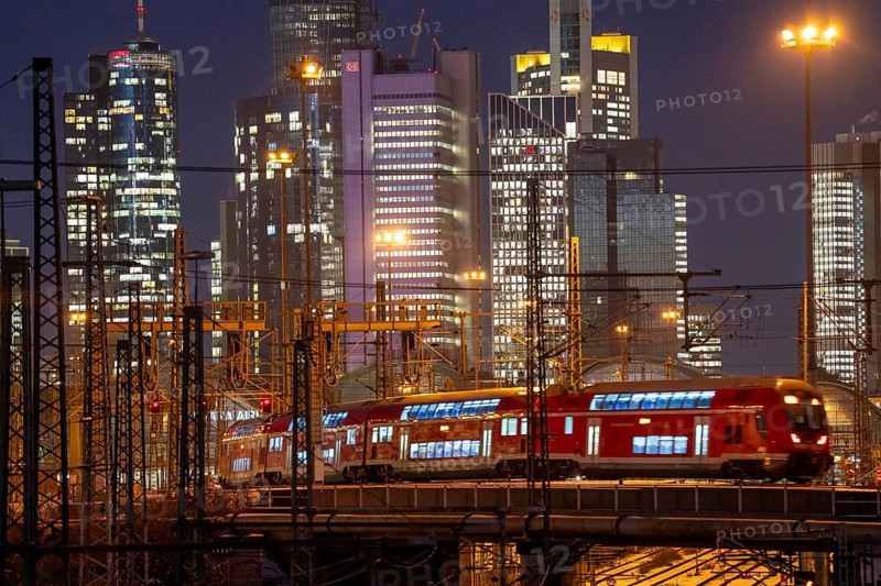 Railway tracks in front of the main railway station in Frankfurt am Main, skyline of skyscrapers in the Cit, winter, snow, dusk, Hesse, North Rhine-Westphalia