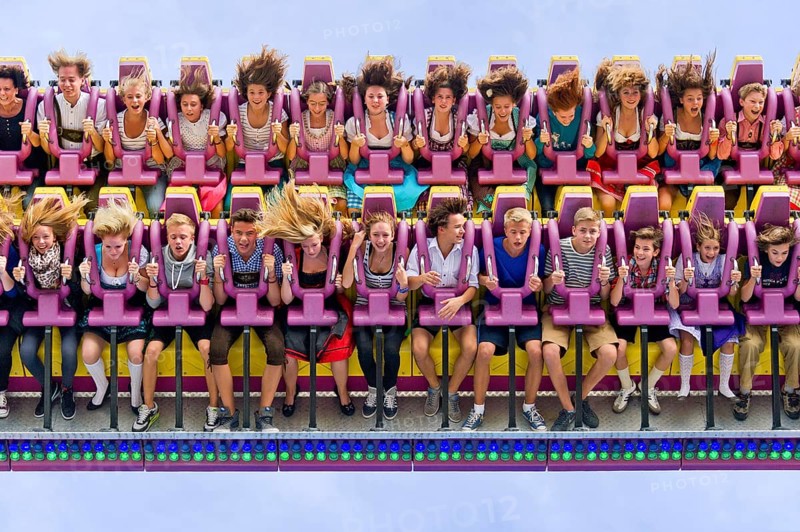 Boys and girls swinging with blowing hair in giant swing Top Spin Fresh, swing, ride on the Wies'n, Oktoberfest, Wiesn, Munich, Upper Bavaria, Bavaria, Germany, Europe