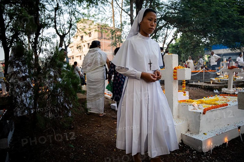 Nuns offer prayers on the grave during the All souls day observation, in Guwahati, India on 2 November 2024. All Souls' Day is a Christian holiday dedicated to honoring and praying for the souls of the departed