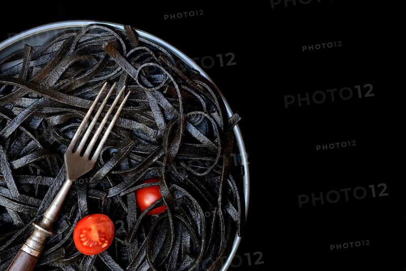 Black pasta coloured with squid ink and fork, Taglioni al Nero di Seppia, Italy, Europe