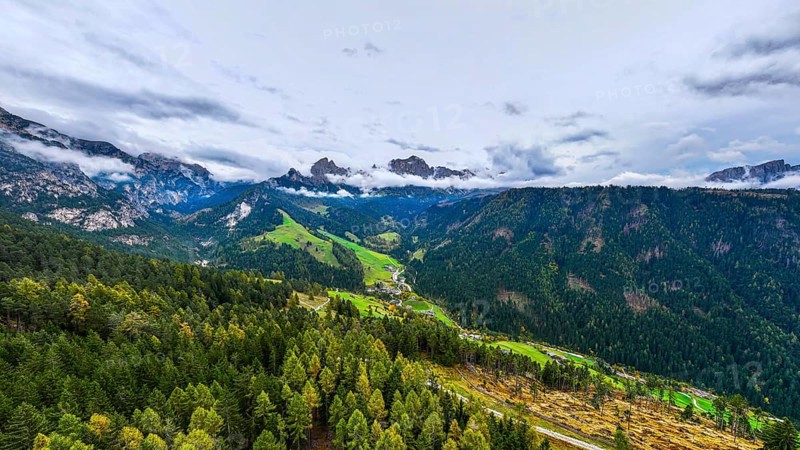 The peaks of the rose garden, shrouded in mist, drone shot, Dolomites, Autonomous Province of Bolzano, South Tyrol, Italy, Europe