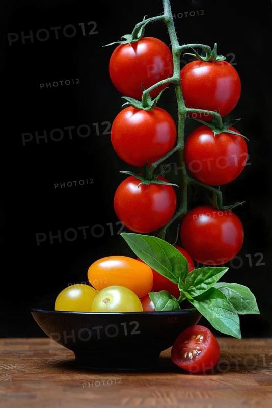 Cherry tomatoes on the stem and in skin, cherry tomato