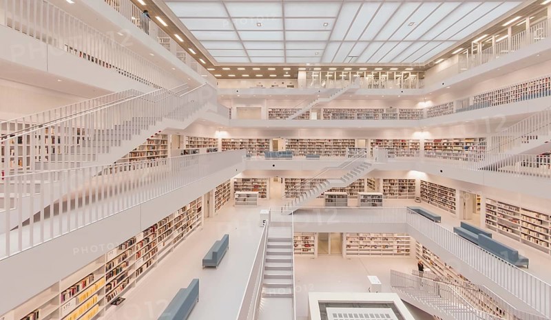 Modern, bright library with open staircases and many bookshelves in a symmetrical arrangement, public library am Mailänder Platz, empty, Stuttgart, Germany, Europe