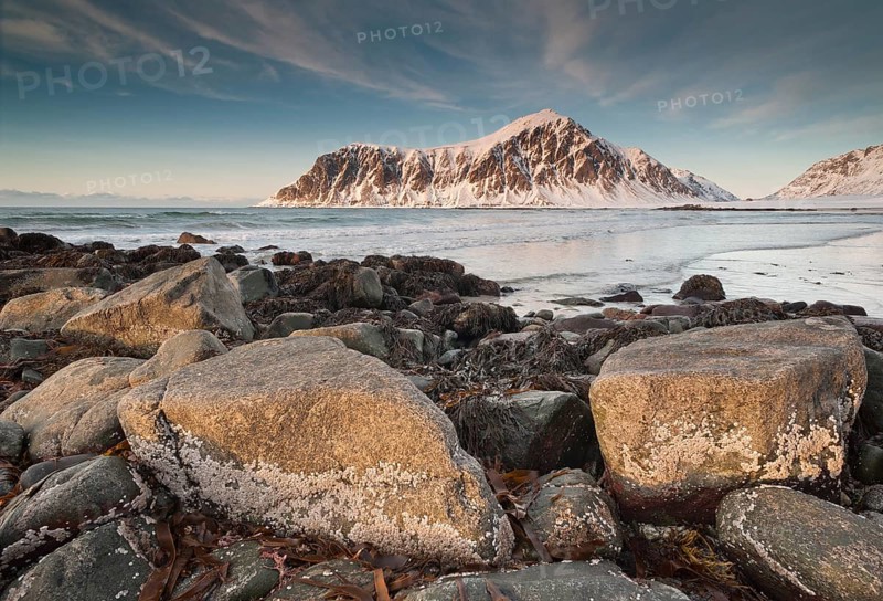 Winter evening mood at Skagsanden, rocks and beach near Flakstad, Flakstadøy, Lofoten, Nordland, Norway, Europe