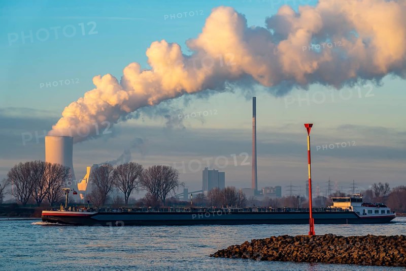 Cooling tower of the coal-fired power plant Duisburg-Walsum, operated by STEAG and EVN AG, 181 metres high, power plant unit 10, water vapour cloud, container cargo ship on the Rhine, Duisburg, North Rhine-Westphalia, Germany, Europe