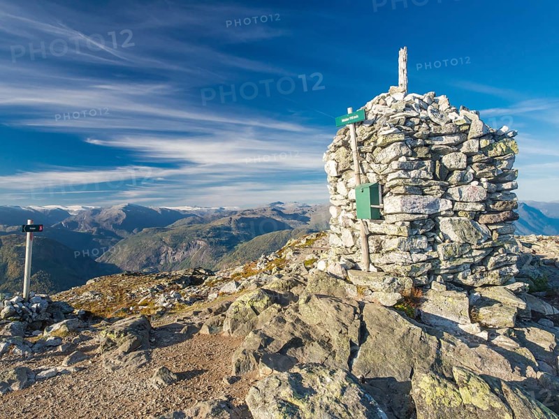 Top of Mt. Molden above the Sognefjord, stone cairn, view towards north, glacier Jostedalsbreen in the back, Norway, Europe