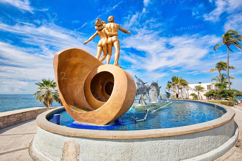 Mazatlan, Mexico-10 December, 2018: Dolphin Statue located on scenic Mazatlan Promenade (Malecon) near the ocean shore and historic city center
