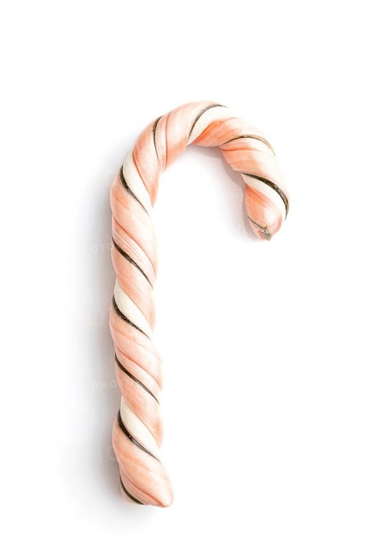Single christmas cane candies isolated on white background. close up, top view, flat lay