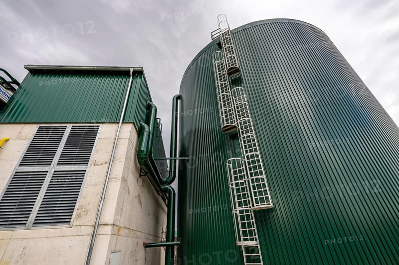 Biogas plant, with hot water storage tank, the gas is produced from various biomass, including waste from the food industry, the electricity is produced in combined heat and power plants with the biogas produced and fed into the grid, the heat is sent to 70 households via a local heating network, part of the gas is processed and fed into the Thyssengas gas network, Anröchte, North Rhine-Westphalia, Germany, Europe
