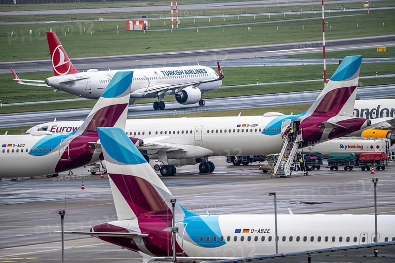 Düsseldorf Airport, Eurowings aircraft on the apron, Turkish Airlines Airbus on the taxiway for take-off, Düsseldorf, North Rhine-Westphalia, Germany, Europe