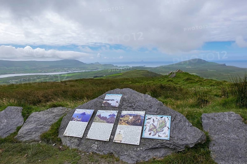 Signposts to the Skellig Rocks lying in the haze on the horizon, County Kerry, Republic of Ireland