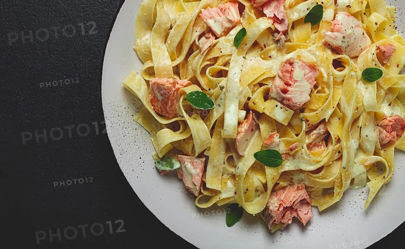 Tagliatelle pasta, in cream sauce with salmon, homemade, no people