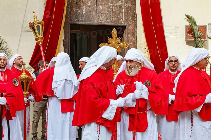 Confraternity of penitents gathering outside San Leonardo church, Enna, Siclly, Italy, Europe