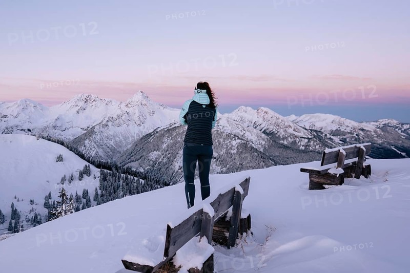 Summit bliss in the snow-covered winter landscape in the Tannheimer Tal in the Alps on the Neunerköpfle, Tyrol, Austria, Europe