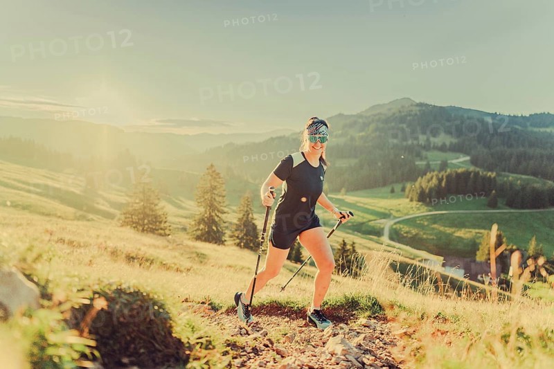 Summer trail running and hiking in the Alps on the Riedberg Pass between Obermaiselstein and Balderschwang in the Allgäu, Bavaria, Germany, Europe