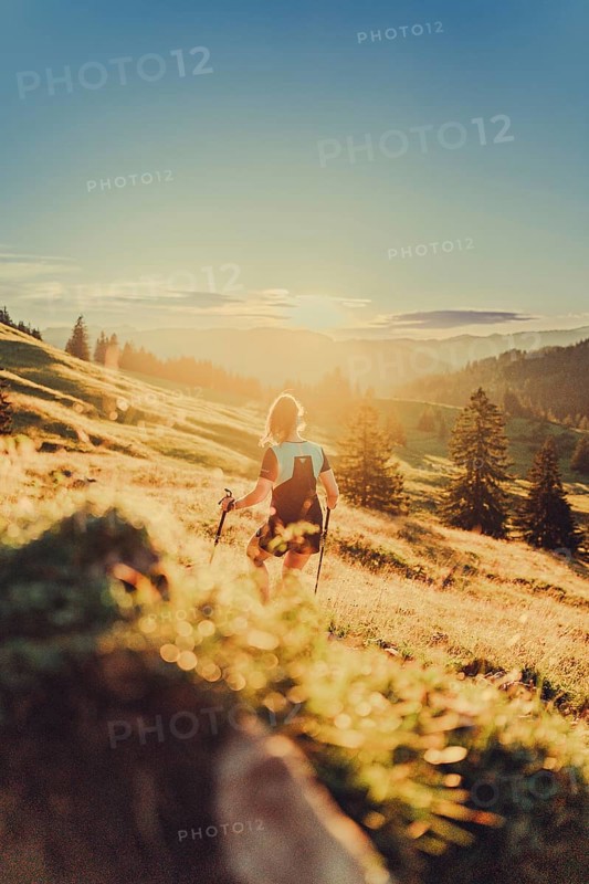 Summer trail running and hiking in the Alps on the Riedberg Pass between Obermaiselstein and Balderschwang in the Allgäu, Bavaria, Germany, Europe