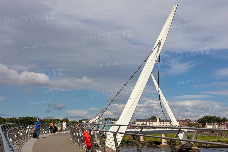 Side view of a modern bridge under a clear blue sky, Londonderry