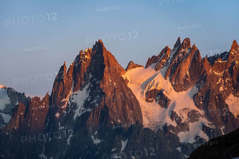 Rocky pointed mountain peaks at sunset, alpenglow, Aiguille du Plan, Mont Blanc massif, Chamonix, France, Europe
