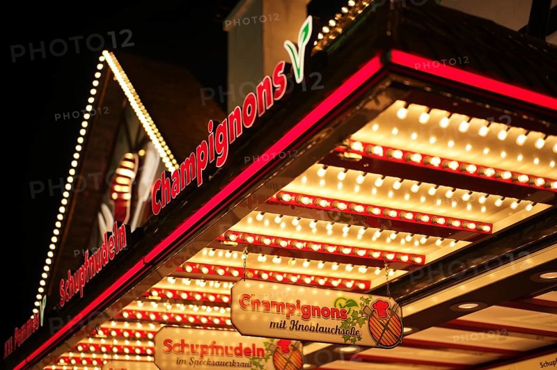Night shot of sales stand, mushrooms, Schupfnudeln, advertising, neon lighting, Cannstatter Wasen, folk festival, Bad Cannstatt, Stuttgart, Baden-Württemberg, Germany, Europe