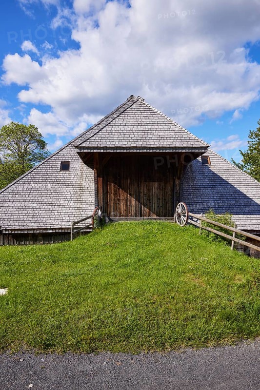 Driveway into a Black Forest house with an old wagon wheel of the Resenhof Farm Museum in the Oberlehen district, Bernau im Black Forest, Black Forest, Waldshut district, Baden-Württemberg, Germany, Europe