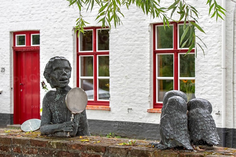 Sculpture group about Till Eulenspiegel, Tijl Uilenspiegel, German folk hero made by Jef Claerhout in the city Damme, West Flanders, Belgium, Europe